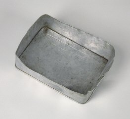 Aluminum food container lid used by a Hungarian Jewish family on the Kasztner train.