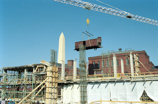 Installation of the railcar at the construction site of the United States Holocaust Memorial Museum.