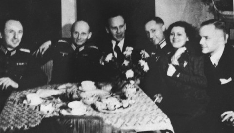 Oskar Schindler (third from left) at a party with local SS officials on his 34th birthday. [LCID: 03377]