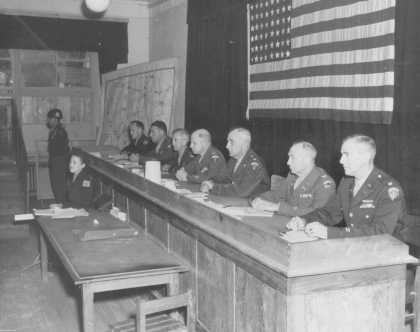 Judges in the trial of 19 men accused of committing atrocities at the Dora-Mittelbau concentration camp, located near Nordhausen. [LCID: 43066]