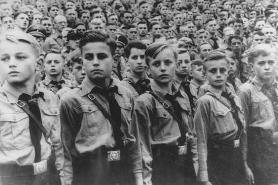  Members of the Hitler Youth attend a Nazi party rally. [LCID: 69822]