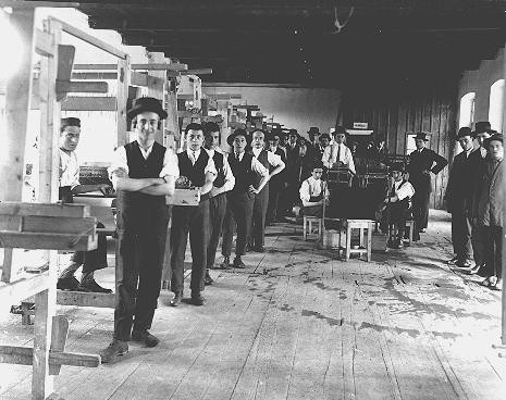 Prewar photograph of students in a weaving workshop at a yeshiva (rabbinical academy) in the northern Transylvanian town of Sighet ... [LCID: 88072]