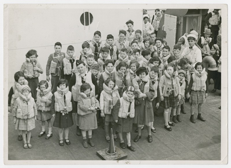 Austrian Jewish children being transported to the United States by Eleanor and Gilbert Kraus perform a life jacket drill aboard the ...