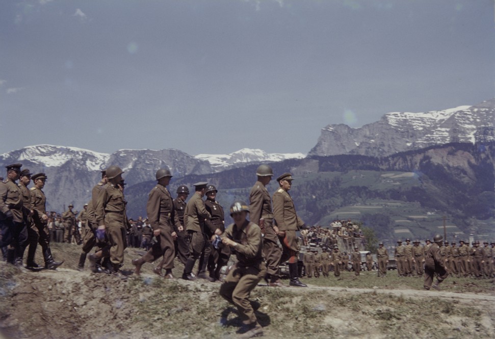 Members of the US 9th Armored Division meet up with Soviet units near Linz, Austria.
