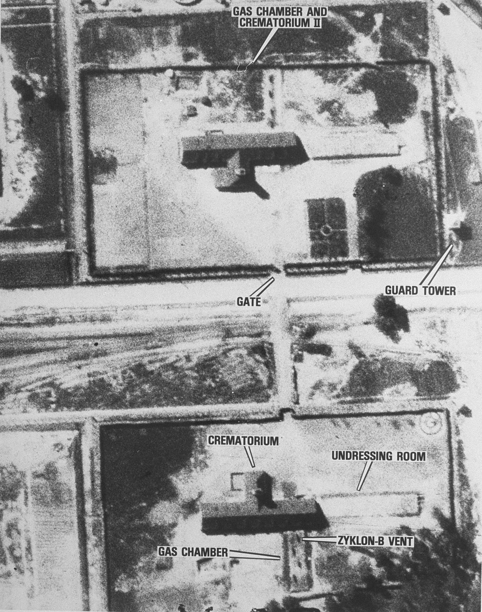 Grainy black and white aerial photo with text labels for various buildings.