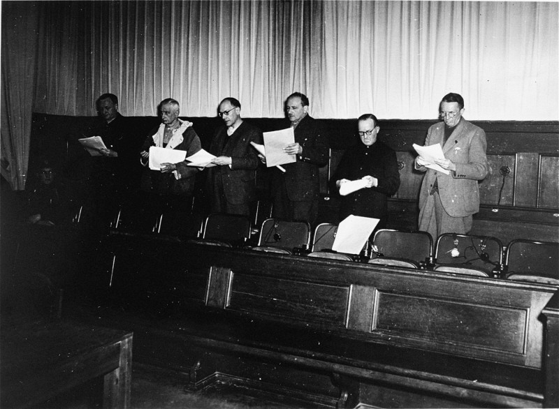 The defendants at the Flick Trial study court documents. From left to right are Bernhard Weiss, Friedrich Flick, Odilo Burkart, Konrad Kaletsch, Otto Steinbrinck, and Hermann Terberger.