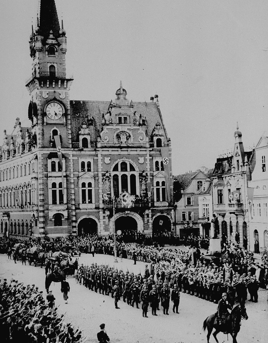 In the aftermath of the Munich agreement, which turned the Sudetenland of Czechoslovakia over to Germany, German troops march into ...