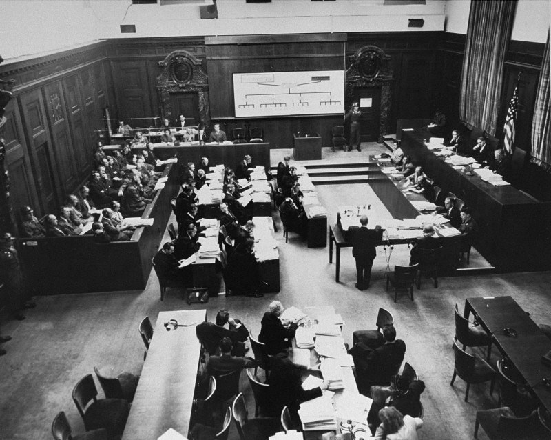 The courtroom during the Einsatzgruppen Trial. Chief Prosecutor Benjamin Ferencz stands in the center of the room. [LCID: 09951]