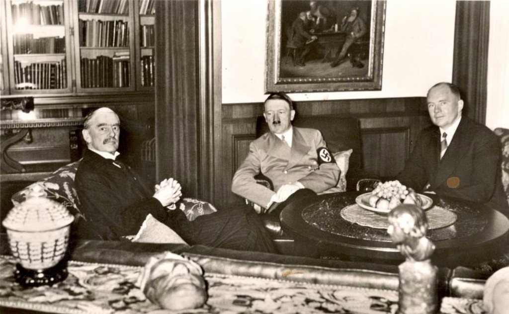 British prime minister Neville Chamberlain (left), German chancellor Adolf Hitler (center), and French premier Edouard Daladier (right) ...