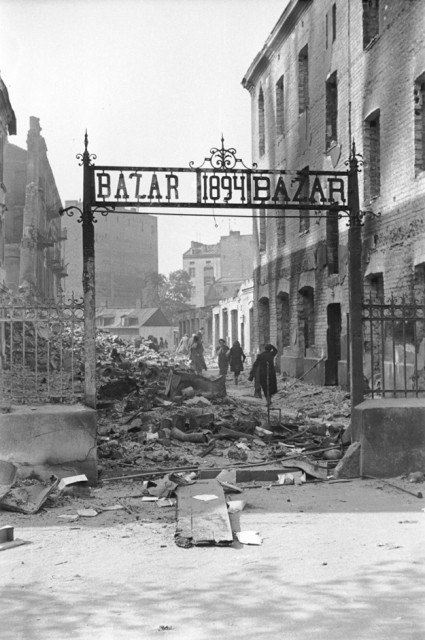 View of the entrance to a marketplace reduced to rubble as a result of a German aerial attack.