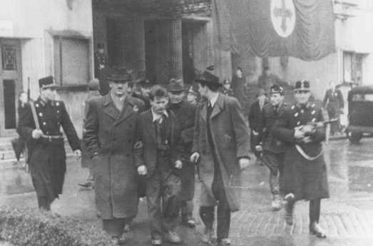 Members of the fascist Arrow Cross Party arrest Jews.