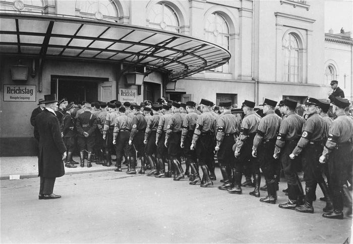 SS detachment files into Kroll Opera House for opening of a Reichstag