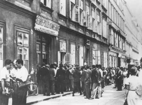 Jews wait in line at the Margarethen police station for exit visas after Germany's annexation of Austria (the Anschluss).