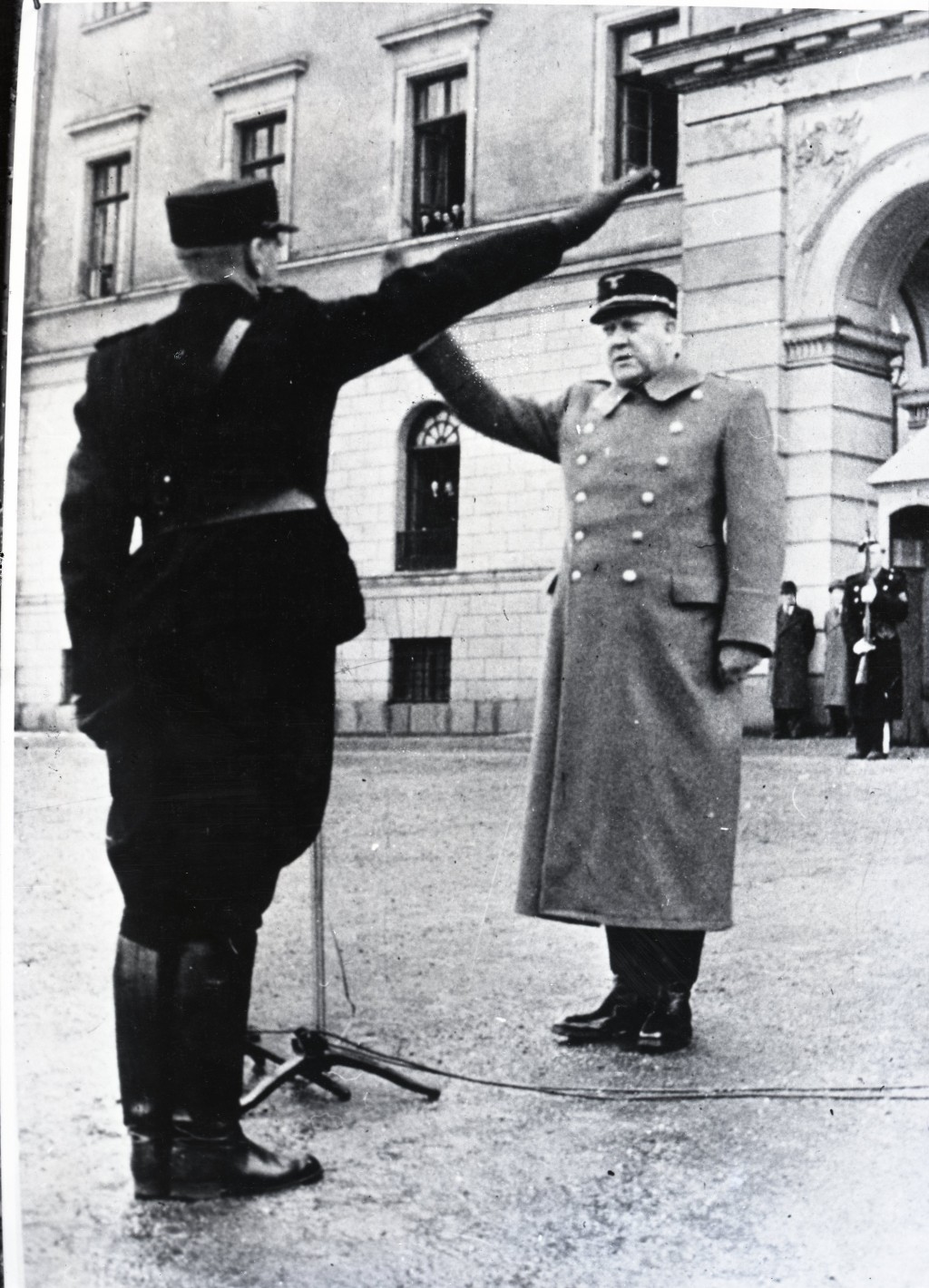 Vidkun Quisling, leader of the collaborationist Norwegian government, returns a salute during a ceremony in Oslo.