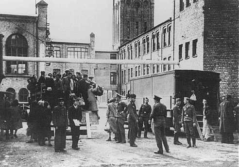 Jews from the Riga ghetto arrive at their forced-labor assignment in the Luftwaffe (German air force) field clothing depot.