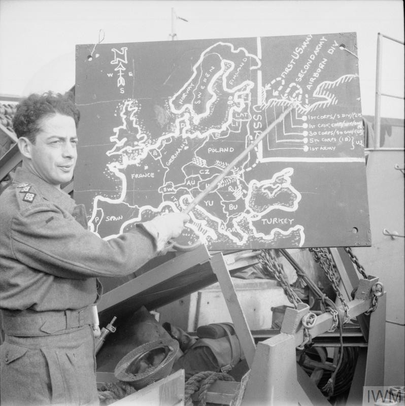 Captain Lasdun briefs troops of the British Army on June 4, 1944, two days before the Allied invasion of Normandy on D-Day.