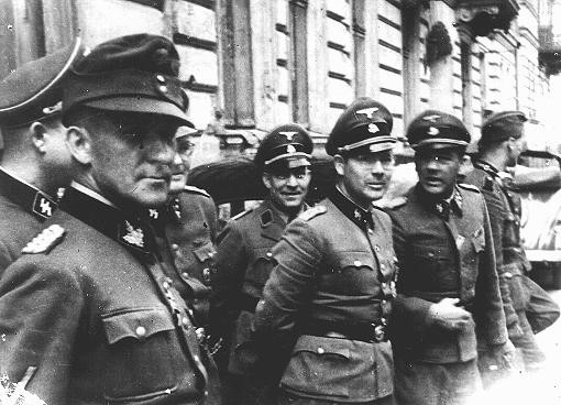 <p>SS General Juergen Stroop (far left) with other German military personnel during the suppression of the Warsaw ghetto uprising. Warsaw, Poland, April-May 1943.</p>