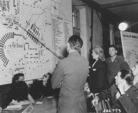 <p>During her trial for war crimes, Ilse Koch points out places she visited in the Buchenwald concentration camp. Germany, 1947.</p>