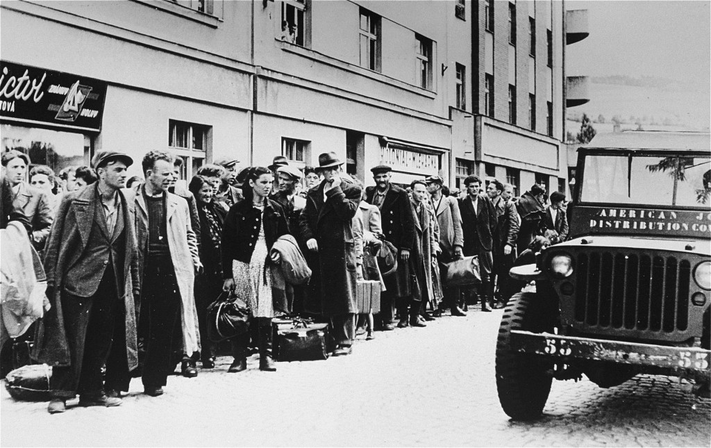 Jewish refugees who fled Poland as part of the postwar mass flight of Jews from eastern Europe (the Brihah) line the streets outside ... [LCID: 70034]