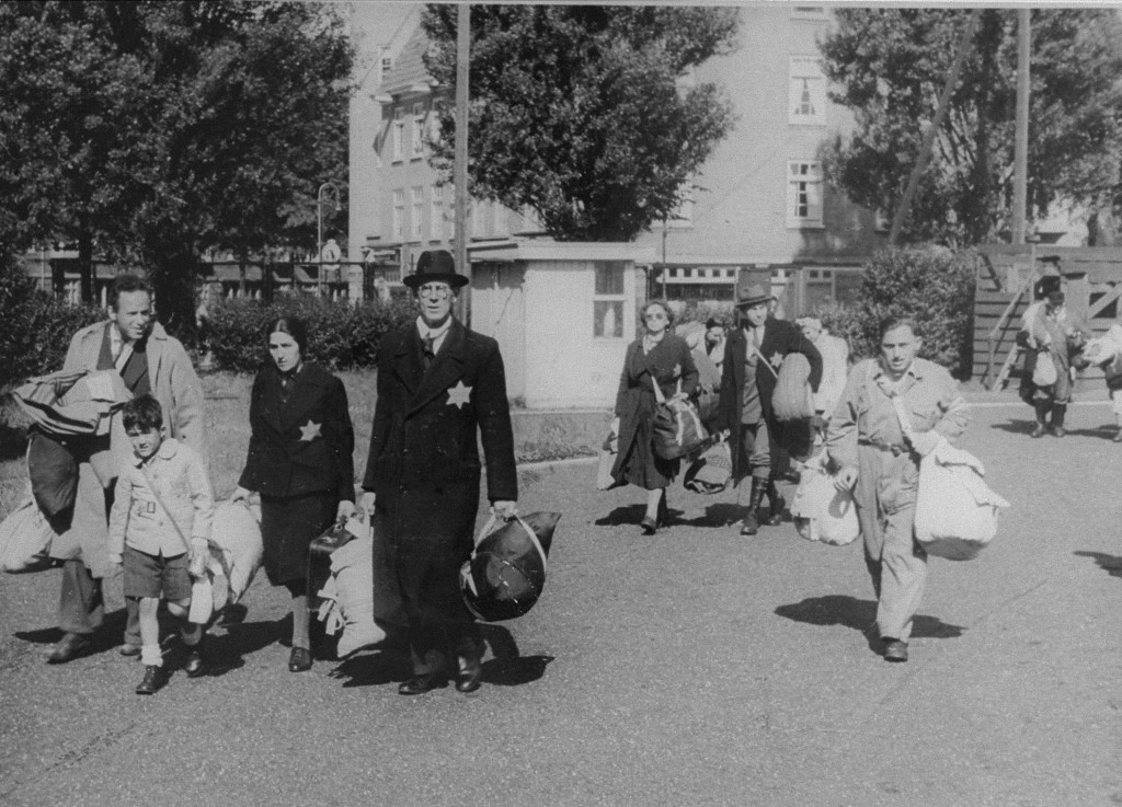 Jews proceed to an assembly point before deportation from Amsterdam.