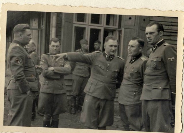 Left to right: Josef Kramer, Dr. Josef Mengele, Richard Baer, Karl Höcker, and an unidentified officer. [LCID: 34759]
