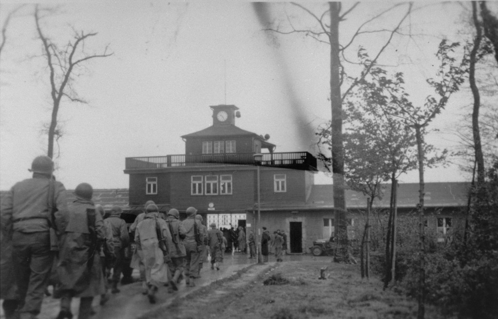 American soldiers enter the Buchenwald concentration camp following the liberation of the camp.