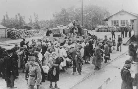 Jewish women, children and the elderly await deportation at the railroad station in Koszeg, a small town in northwestern Hungary.