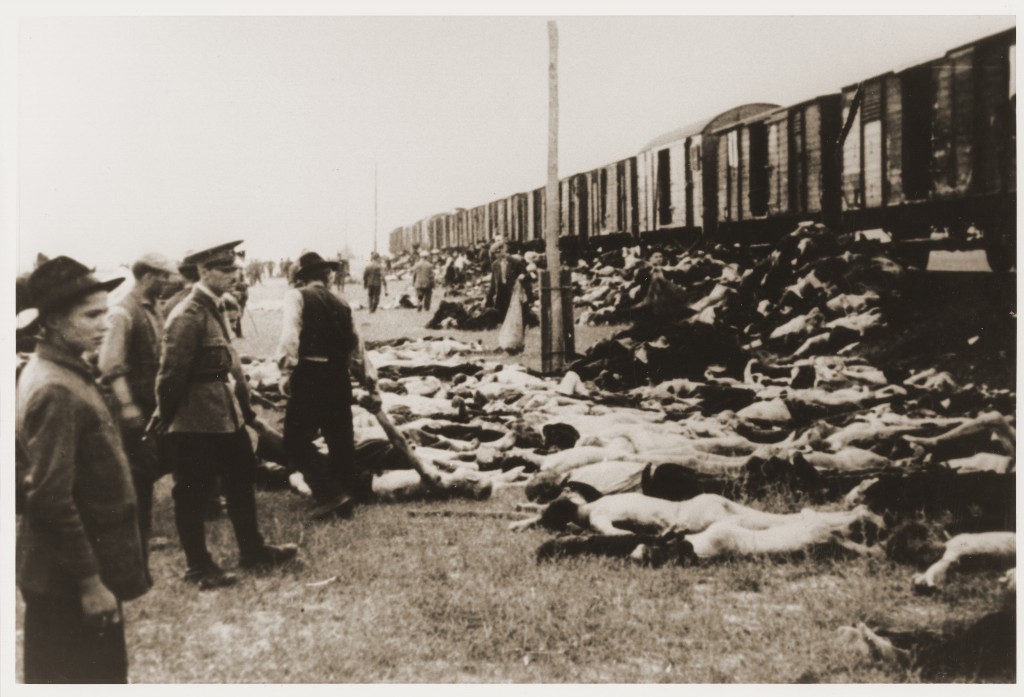 During the deportation of survivors of a pogrom in Iasi to Calarasi or Podul Iloaei, Romanians halt a train to throw off the bodies of those who had died on the way. Romania, July 1941.