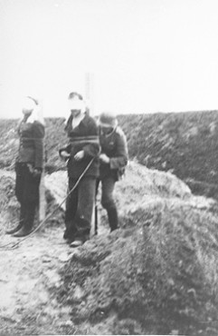 <p>As part of systematic reprisals for deaths of German soldiers and ethnic German civilians during the invasion of Poland, German army troops execute Poles in Cycow, Poland, in September 1939.</p>