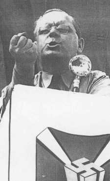 Fritz Kuhn, head of the antisemitic and pro-Nazi German American Bund, speaks at a rally.