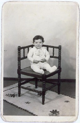 Portrait of Tsewie Herschel seated in a chair, taken while he was living in hiding. [LCID: 58189]