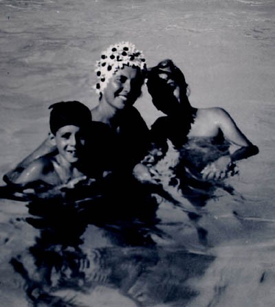 Regina with sons Harry and Paul in a swimming pool.