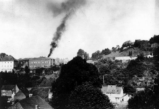 Smoke rising from the chimney at Hadamar, one of six facilities which carried out the Nazis' Euthanasia Program. [LCID: 86721a]