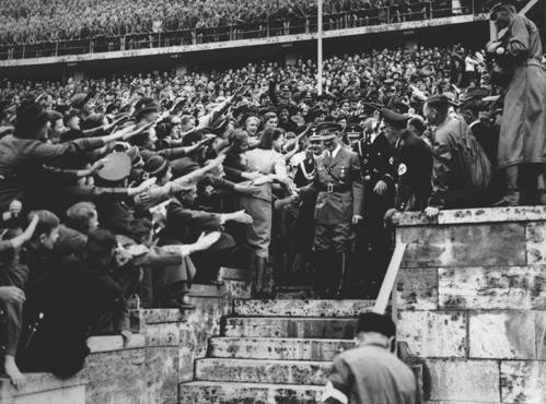 An enthusiastic crowd greets Adolf Hitler upon his arrival at the Olympic Stadium.