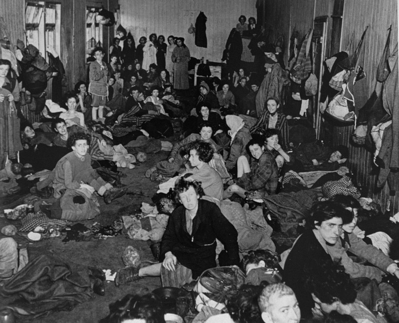 Romani (Gypsy) survivors in a barracks of the Bergen-Belsen concentration camp during liberation.