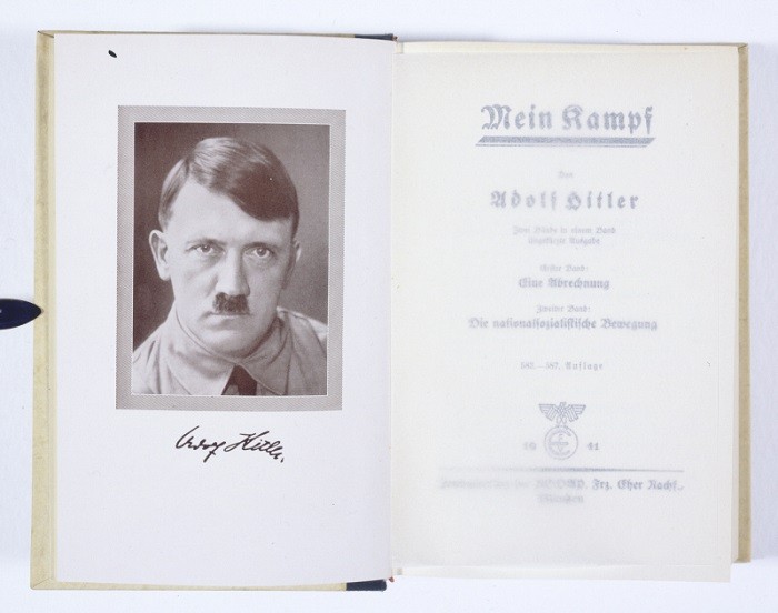 The title page of Mein Kampf by Adolf Hitler. This copy has an inscription by Hitler on the inside cover (not shown) that reads "To the Newlyweds with best wishes for a happy and blessed marriage." Munich, Germany, 1941.