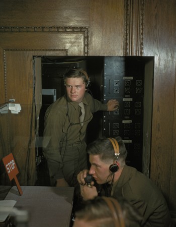 Translators operate an IBM machine during a session of the International Military Tribunal. [LCID: 96314]