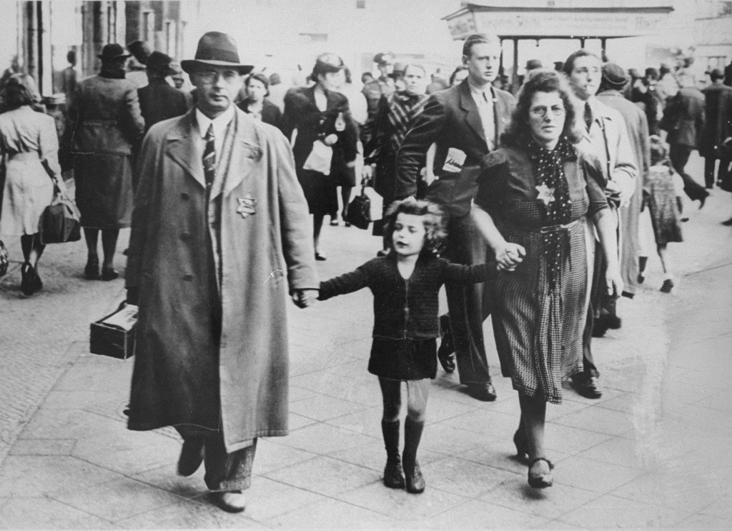 Members of a Jewish family walking along a Berlin street wear the compulsory Star of David. [LCID: 55169]