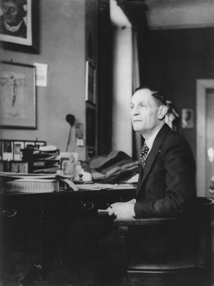 Pastor Martin Niemöller at his desk in his home. Berlin, Germany, ca. 1936.