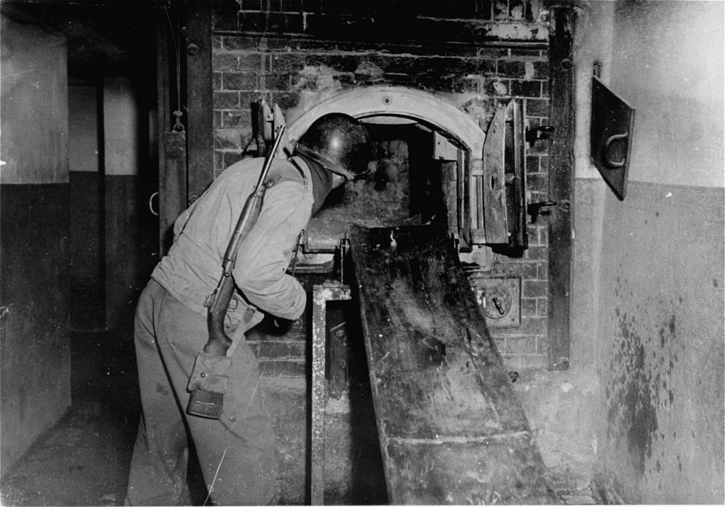 An American solider looks at the Mauthausen crematorium during the liberation of the camp.