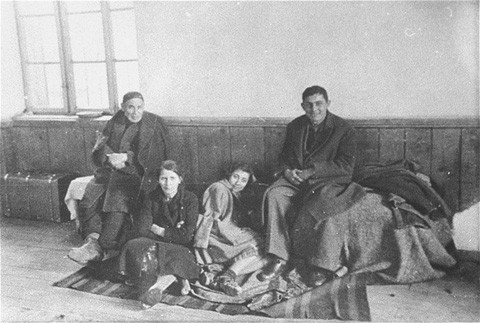 At the Tobacco Monopoly transit camp in Skopje, a family of Macedonian Jews awaits deportation.