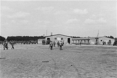 On May 2, 1945, the 8th Infantry Division and the 82nd Airborne Division encountered the Wöbbelin concentration camp. This photograph shows US troops in the Wöbbelin camp. Germany, May 4–6, 1945.