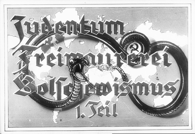 Propaganda slide entitled "Jewry, Freemasonry and Bolshevism," featuring a poisonous snake with bared fangs. This served as the title slide for Part I of a lecture series produced by "Der Reichsfuehrer SS, der Chef des Rasse-und Siedlungshauptamtes" (the Leader of the SS, the Chief of the Race and Settlement Main Office), ca. 1936.