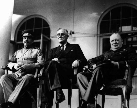 Soviet leader Joseph Stalin (left), US president Franklin D. Roosevelt (center), and British prime minister Winston S. Churchill (right) at the Tehran Conference. Tehran, Iran, between November 28 and December 1, 1943.