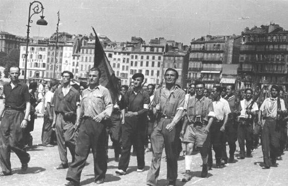  An emigre section of the French resistance marches through Marseille after the city's liberation. [LCID: 63700b]
