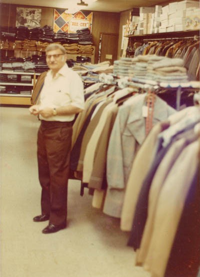 Aron standing in Howard's men's clothing store (named for his eldest son) at 9125 Commercial Avenue in Chicago.
