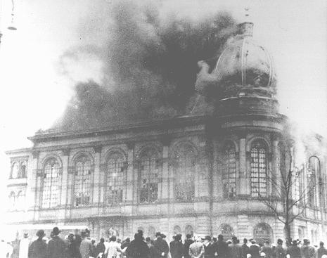 The Boerneplatz synagogue in flames during Kristallnacht (the "Night of Broken Glass"). [LCID: 64675]