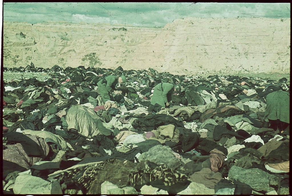 <p><span style="font-weight: 400;">SS men search through massive piles of clothing belonging to the more than 33,000 Jews murdered at the nearby <a href="/narrative/5337">Babyn Yar</a> killing site. The SS forced the victims to undress and leave their belongings behind. The Jews were then marched or driven to the shooting site. Kyiv (Kiev), German-occupied Soviet Union, after September 30, 1941. </span></p>
