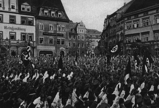 <p>A Nazi rally in market square, in the town center of historic Weimar where the constitution of the Weimar Republic was drafted in 1919. Germany, 1932.</p>