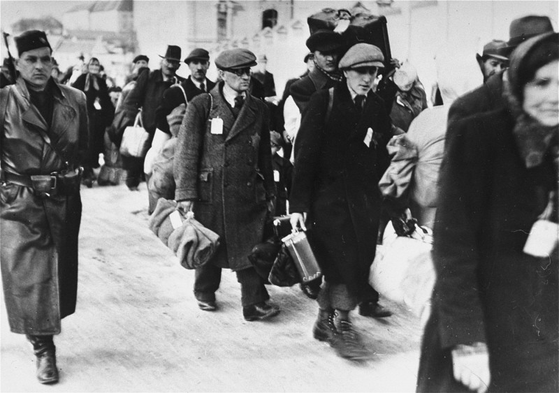 Deportation of Slovak Jews. The victims wear tags and are escorted by Slovak guards.